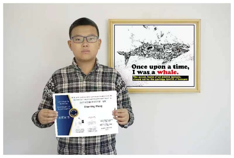 Picture of Mr. Shanning Wang holding a certificate
